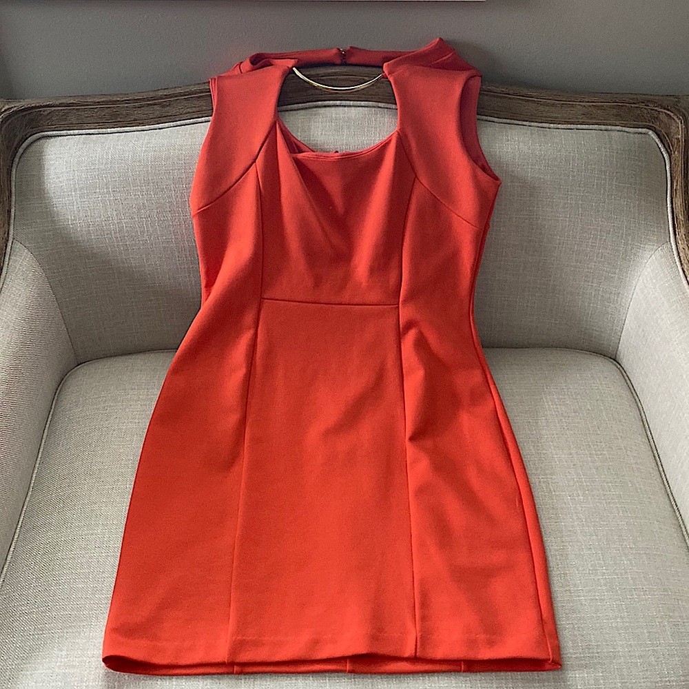 Beautiful orange  dress, size 10 with gold plated accents.